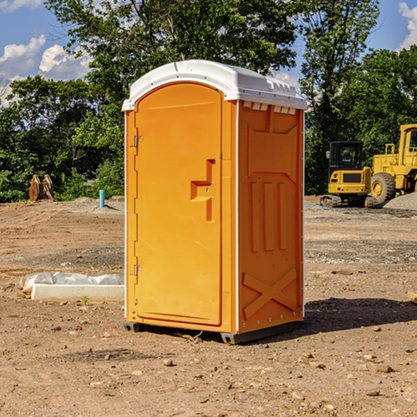 what is the cost difference between standard and deluxe portable restroom rentals in Hague